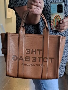 The Tote Bag by Marc Jacobs, specifically the Medium Leather version Clean